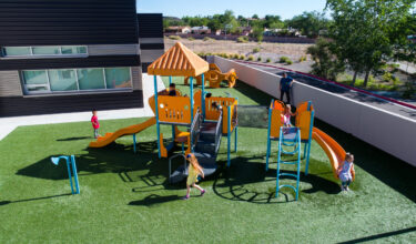 large play structure at marie hughes elementary playground