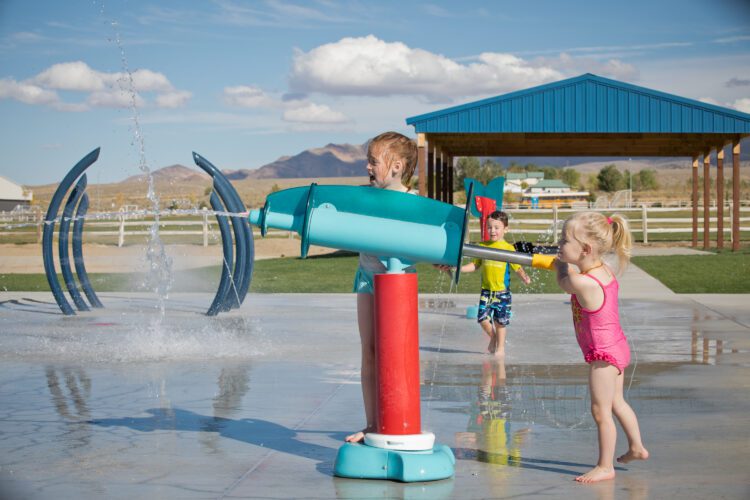 kids playing with water squirt gun