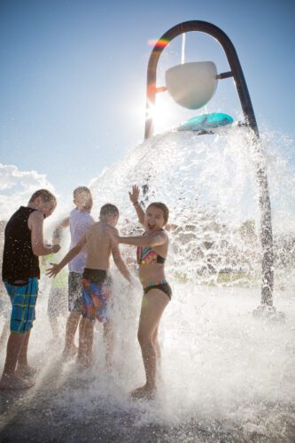 kids getting water dumped on them