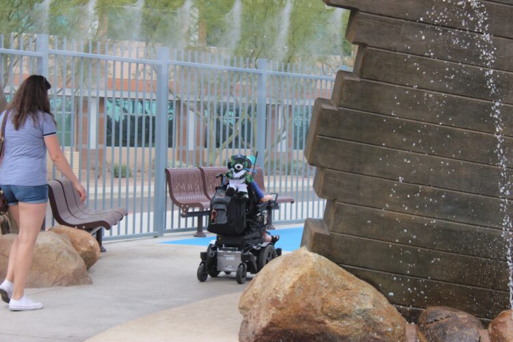 person using wheelchair in accessible park