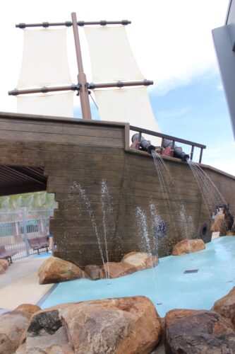 water spraying the side of the playground ship