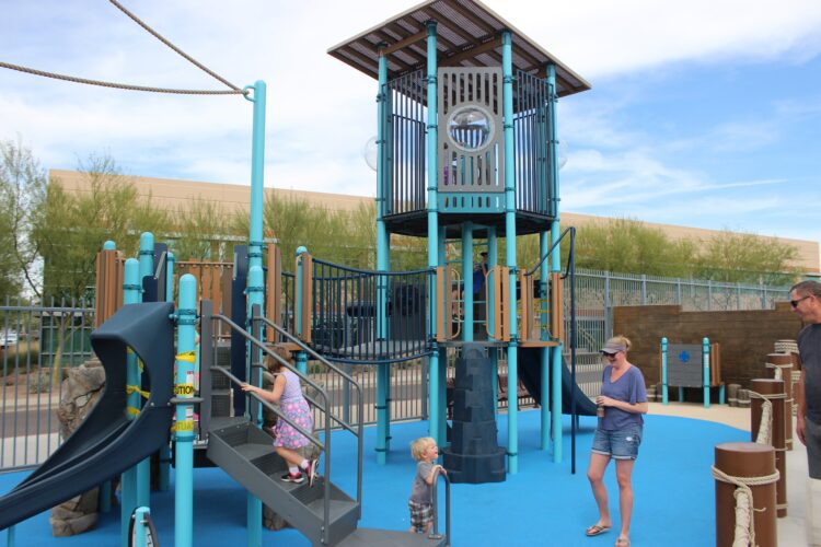 kids climbing up playground stairs