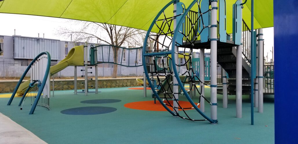 playground net and equipment underneath shade