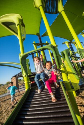 girls coming down from playground