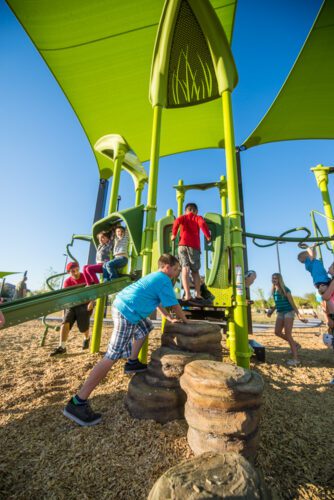 kids going up playground stairs