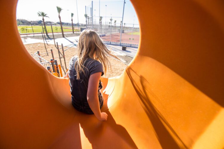 girl going down the slide