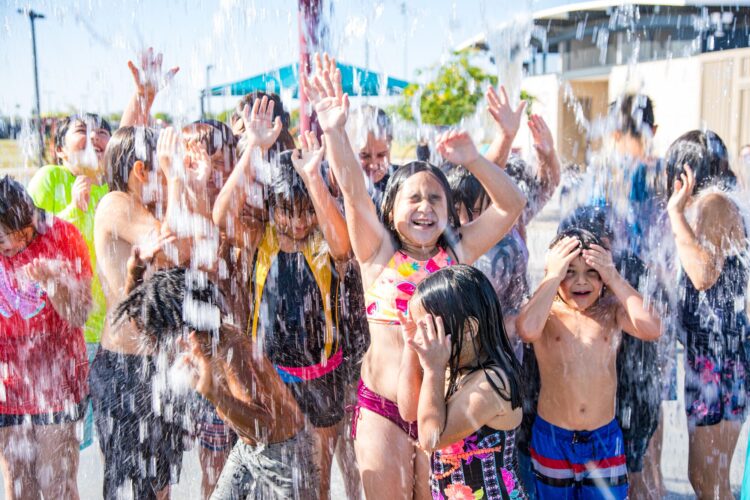 kids playing in the water at Festival fields splash pad