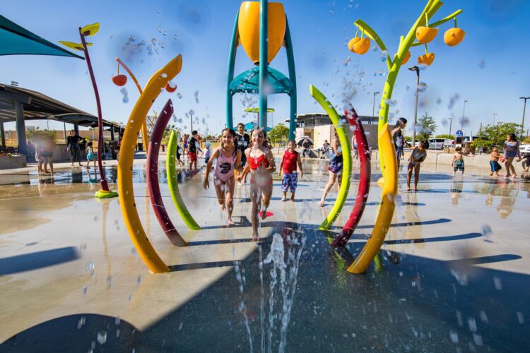 kids running on splash pad