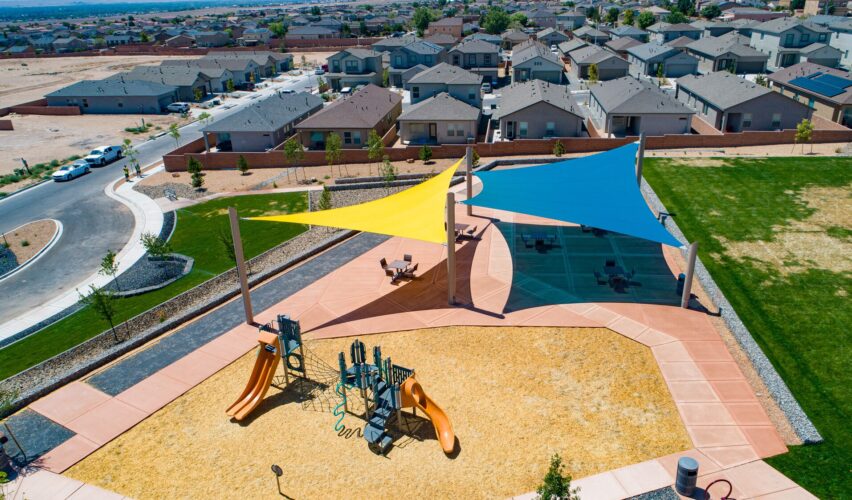 large yellow and blue sun shades near play structure