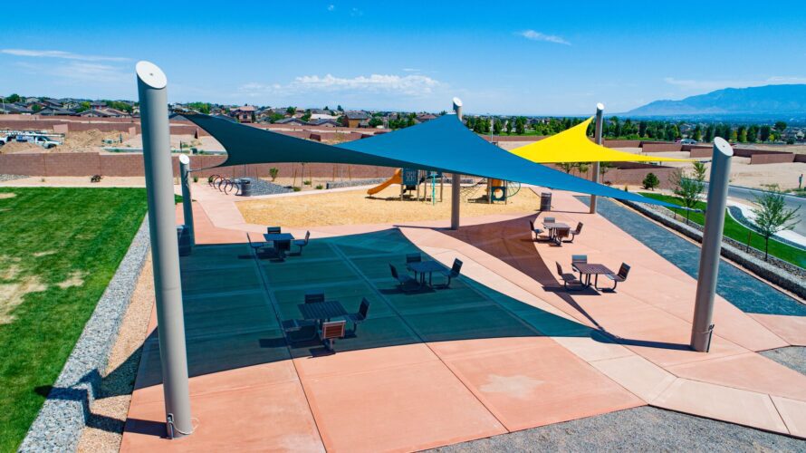 sun shades over picnic tables