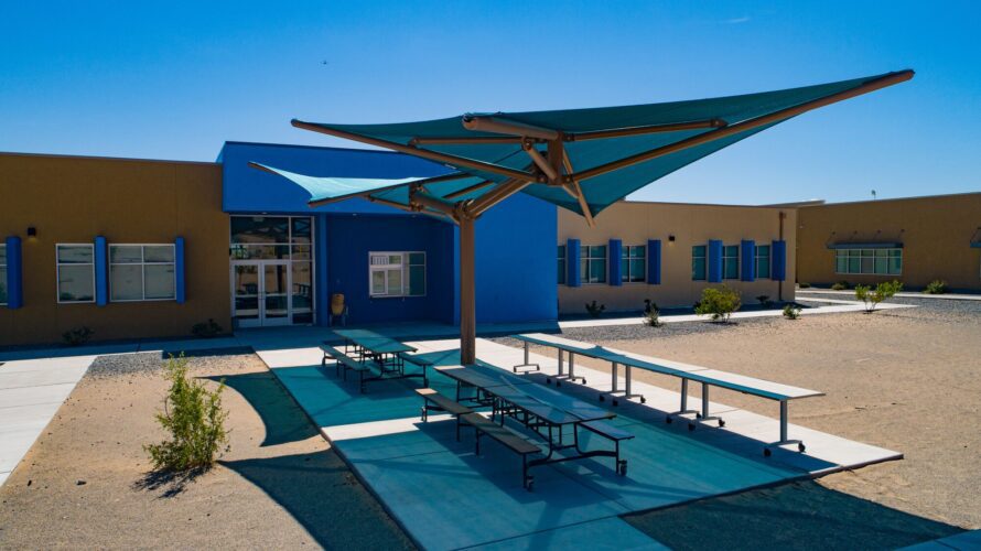 outdoor school tables covered in shade