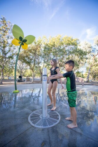 kids playing with spray equipment