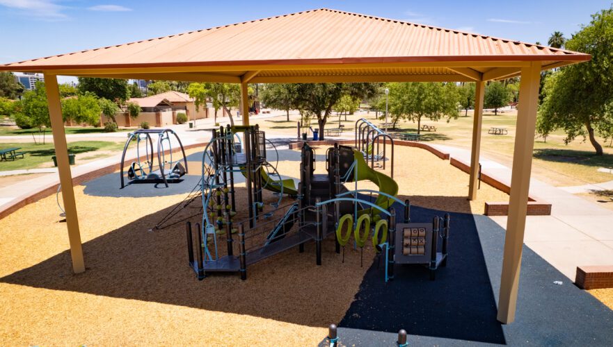 playground equipment underneath shade structure at Encanto Park