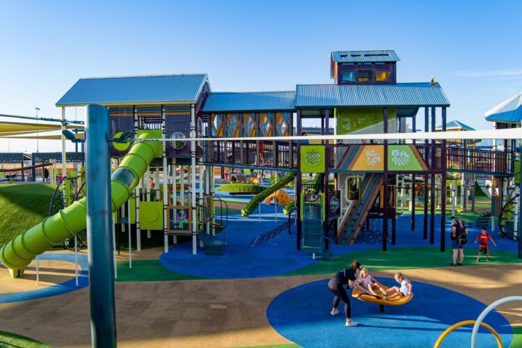 kids playing at a park on the equipment