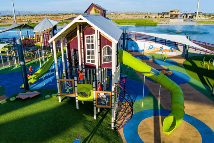 large room built into playground with slides coming out of it